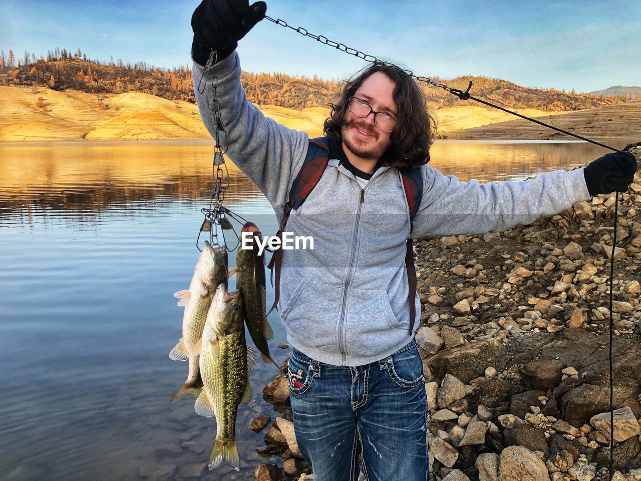 Young man fishing in lake