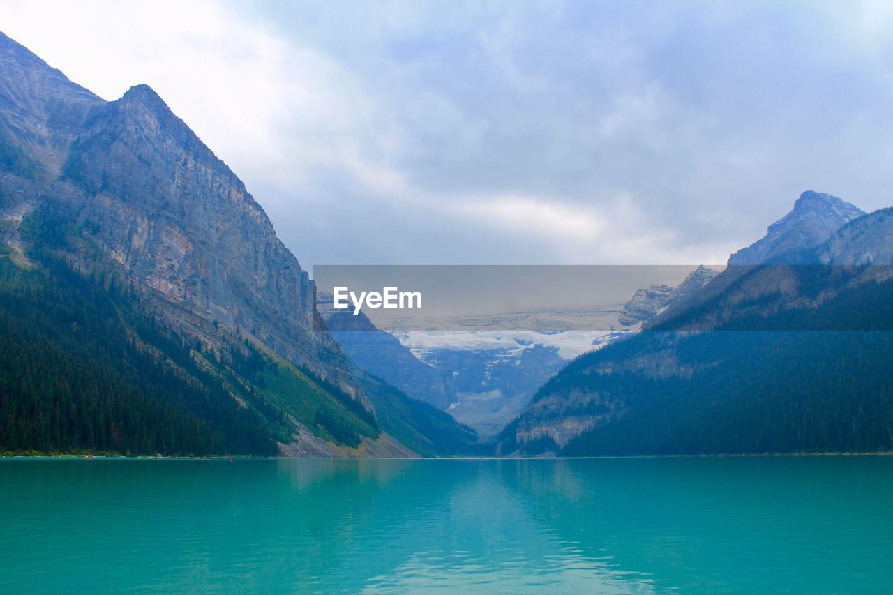 SCENIC VIEW OF LAKE AND MOUNTAIN AGAINST SKY