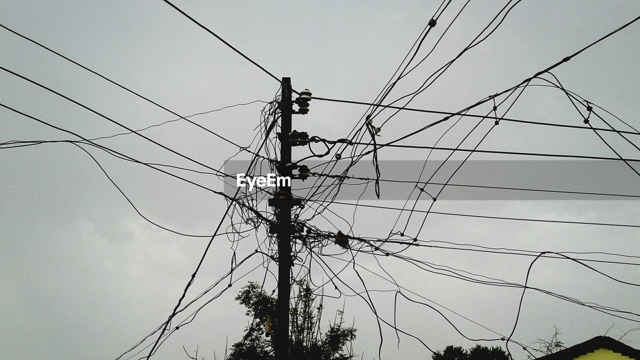 LOW ANGLE VIEW OF POWER LINES AGAINST SKY