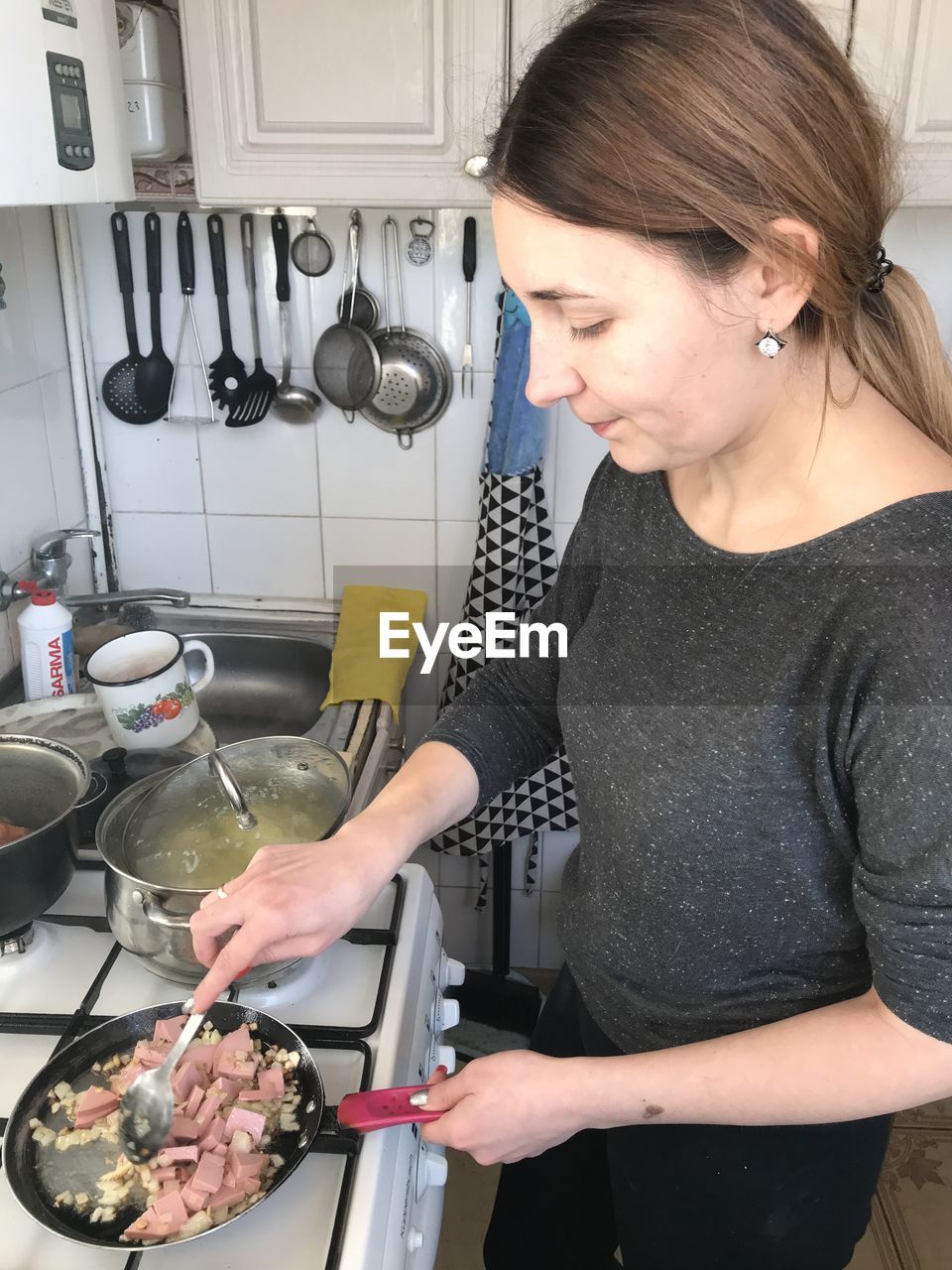 High angle view of woman preparing food in kitchen