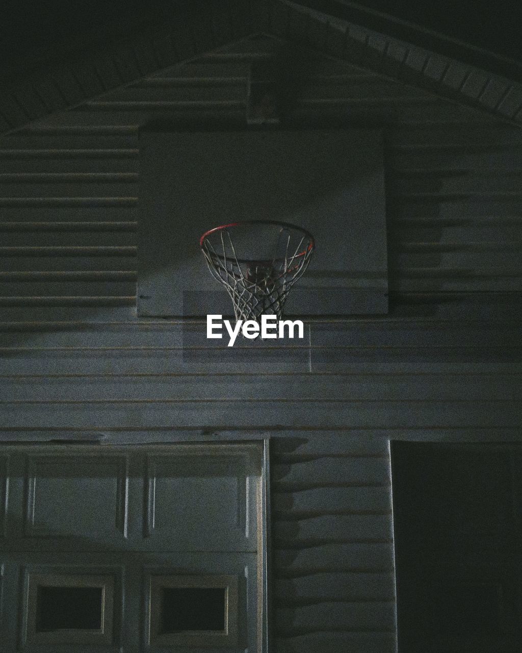 Low angle view of basketball hoop on house