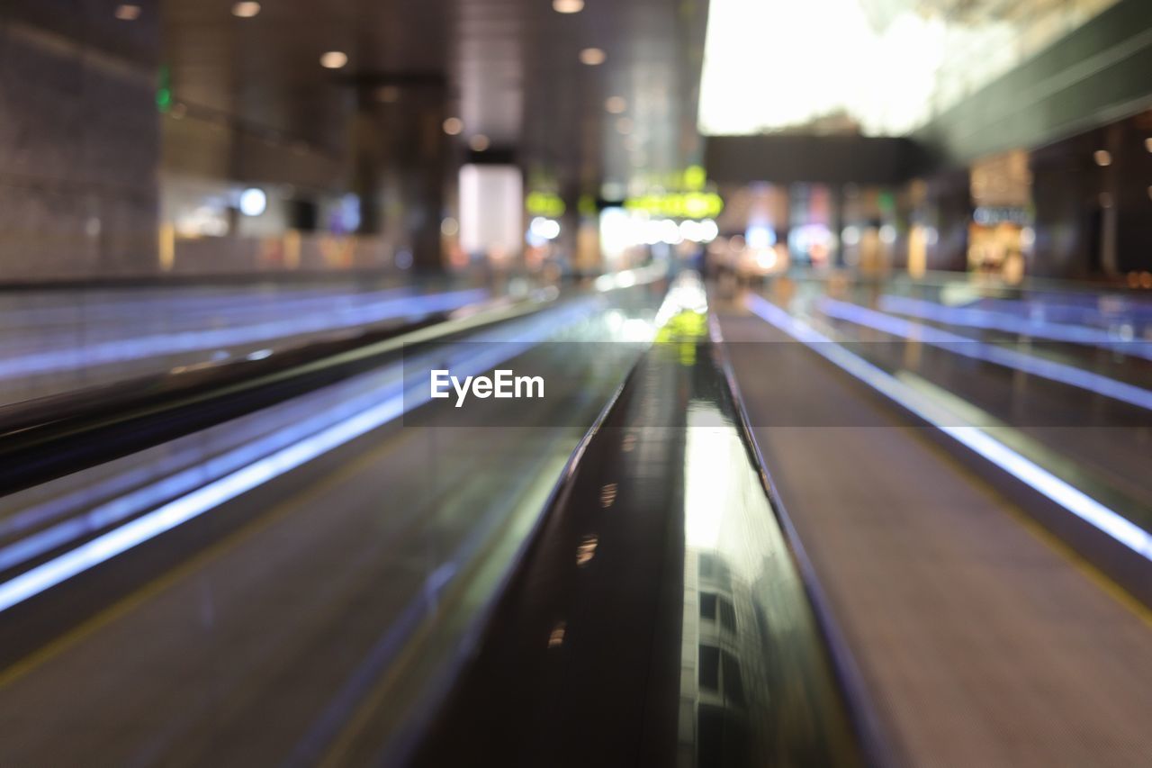 VIEW OF ILLUMINATED ROAD IN UNDERGROUND
