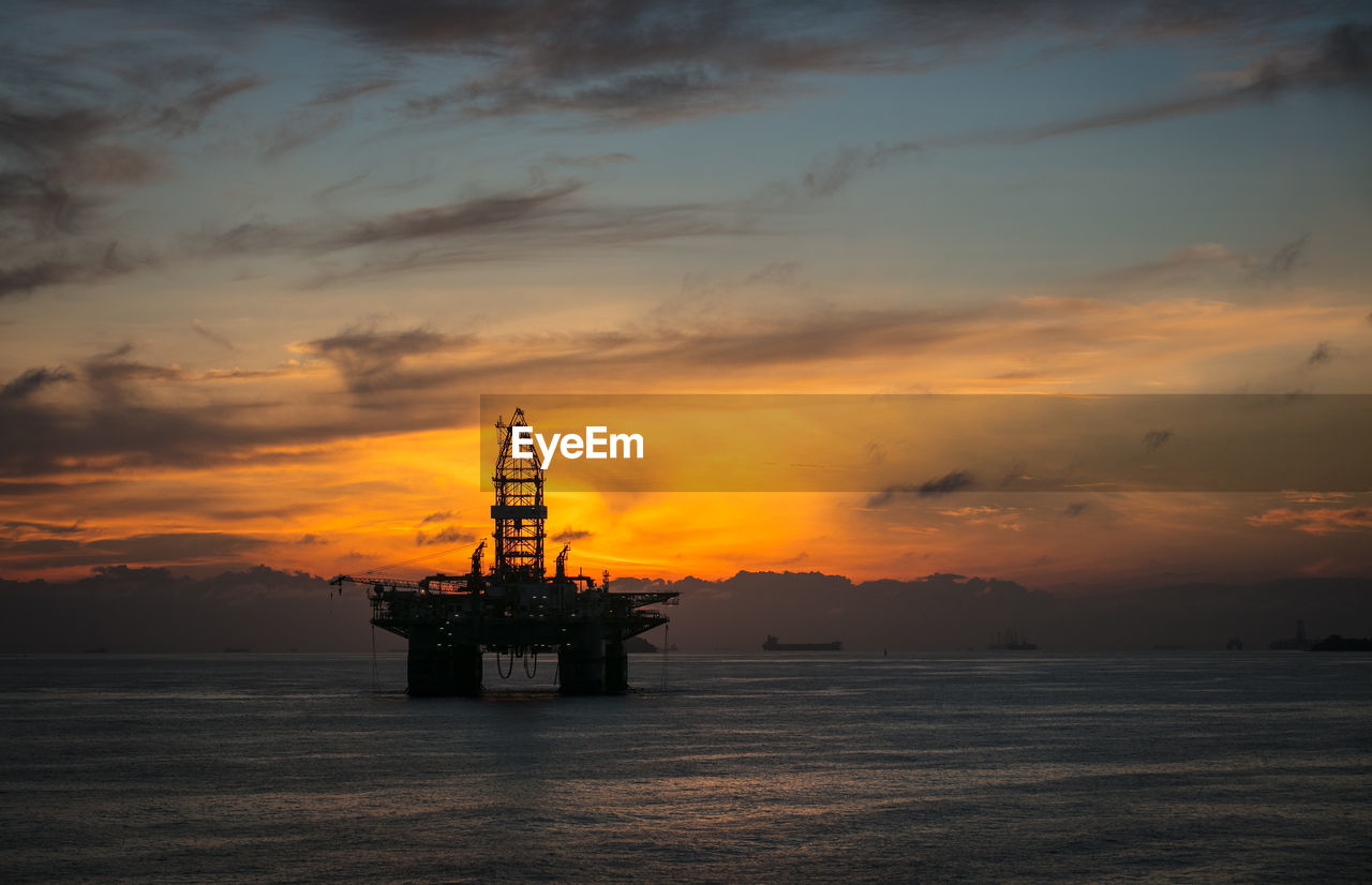 A silhouette of the drilling semi submersible platform anchored in the brunei bay in the morning 