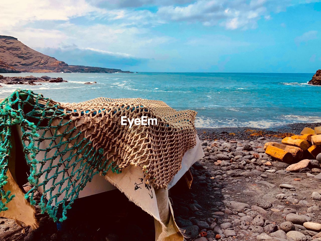 Close-up of fishing boat at beach