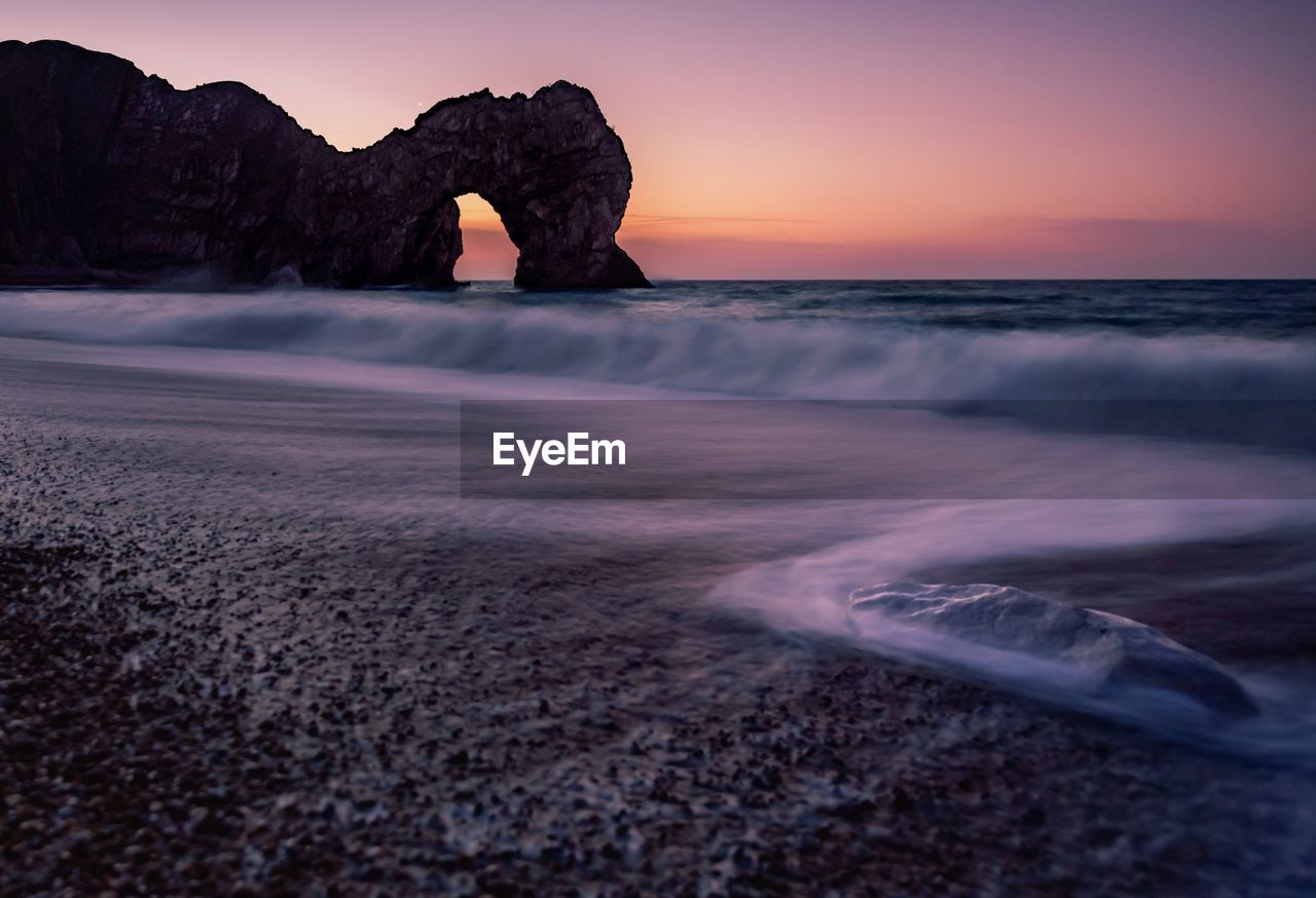 Scenic view of sea against sky during sunset