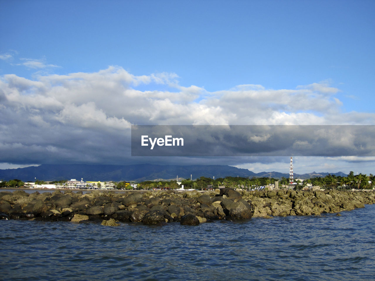 SCENIC VIEW OF SEA AGAINST BUILDINGS