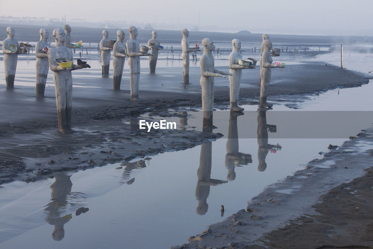 WOODEN POSTS IN SEA