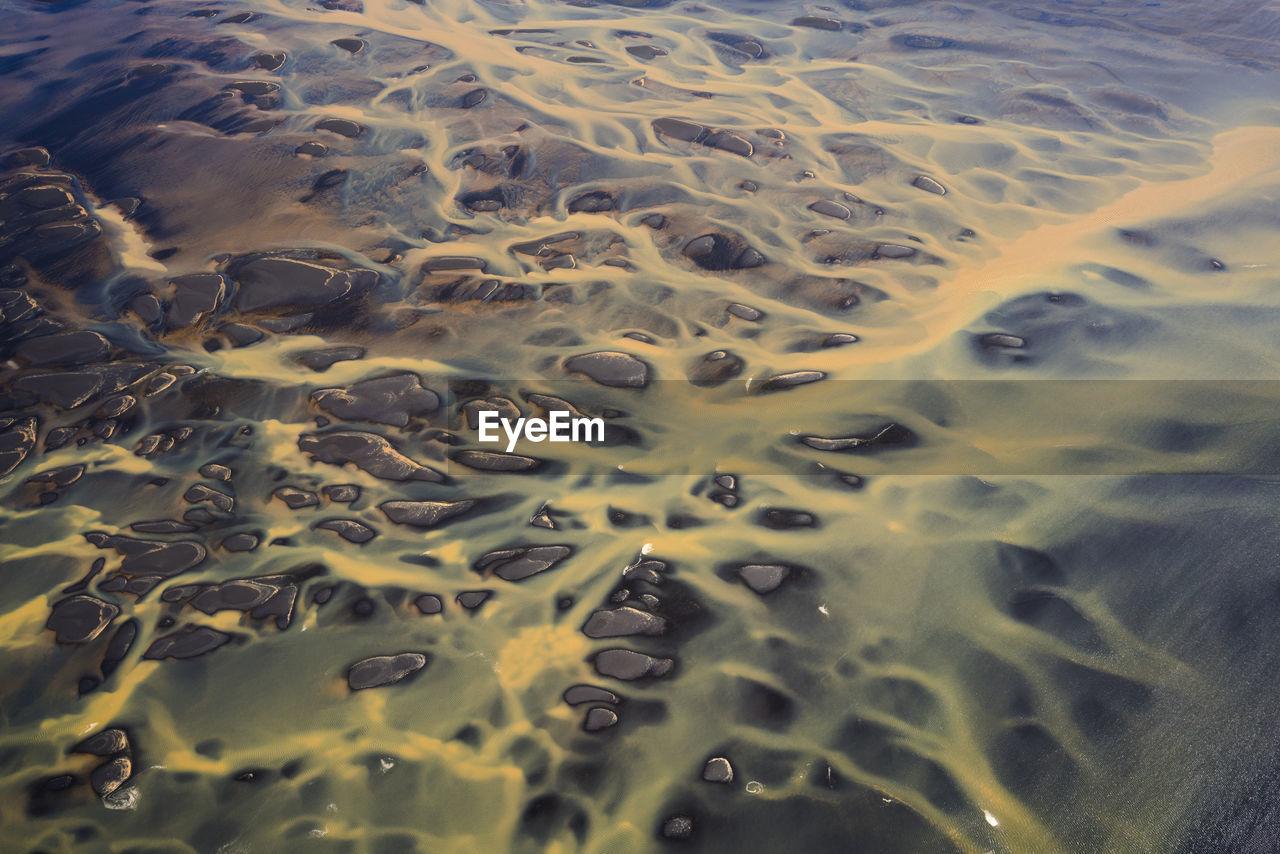 Aerial view of braided orange rivers in southern iceland