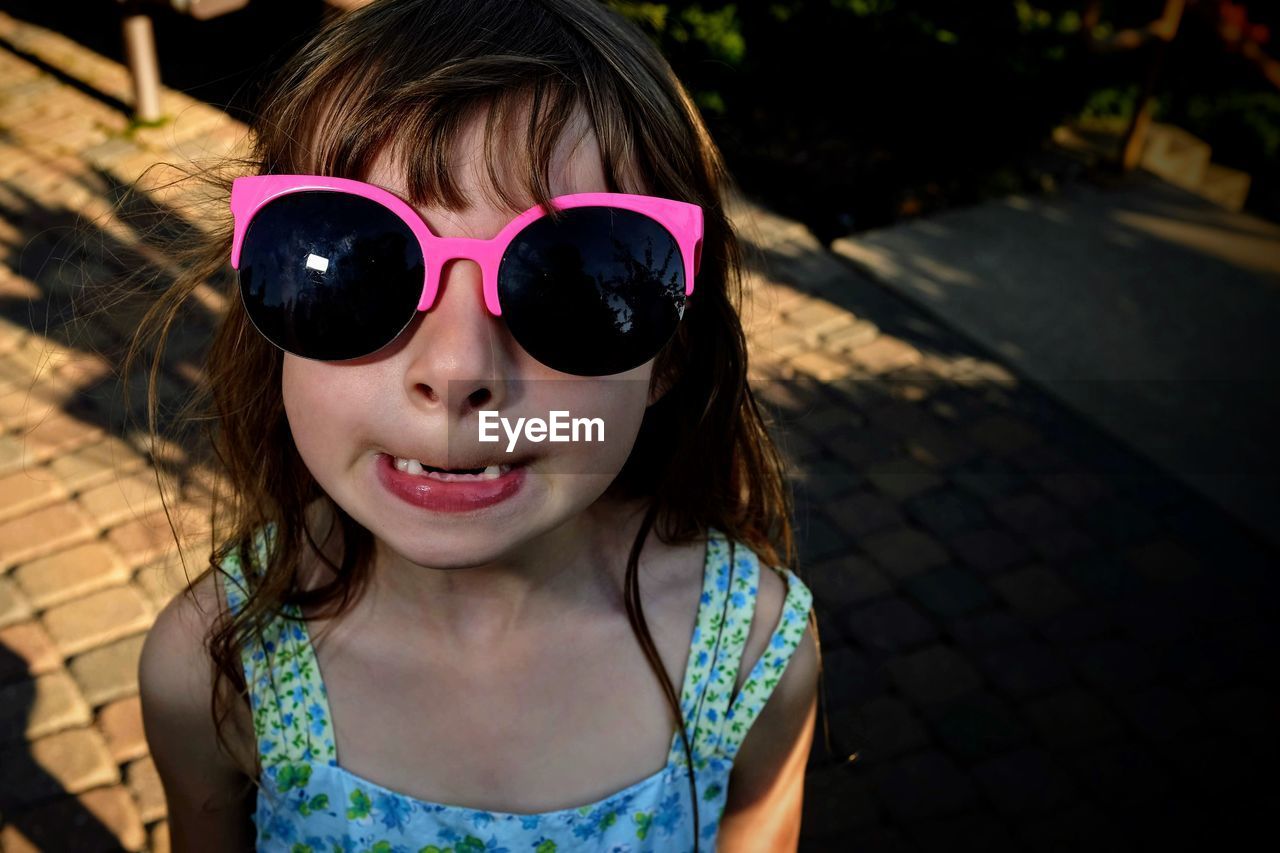 Close-up of girl wearing sunglasses