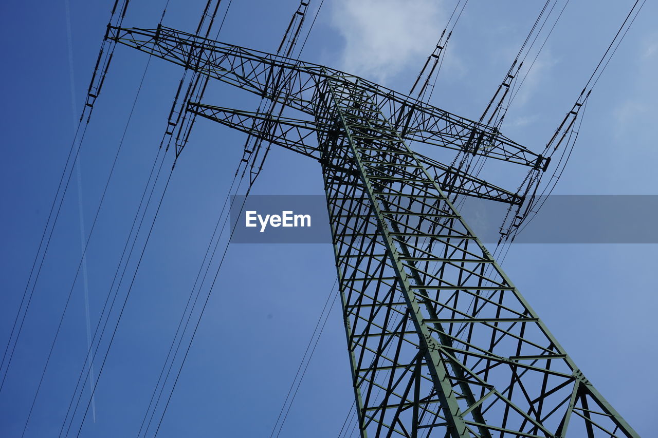 Low angle view of electricity pylon against sky