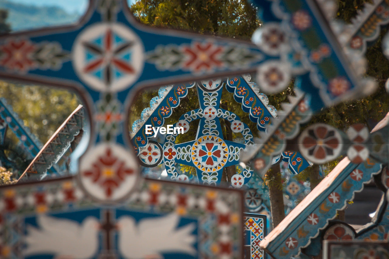 Close-up of multi colored handicrafts hanging for sale