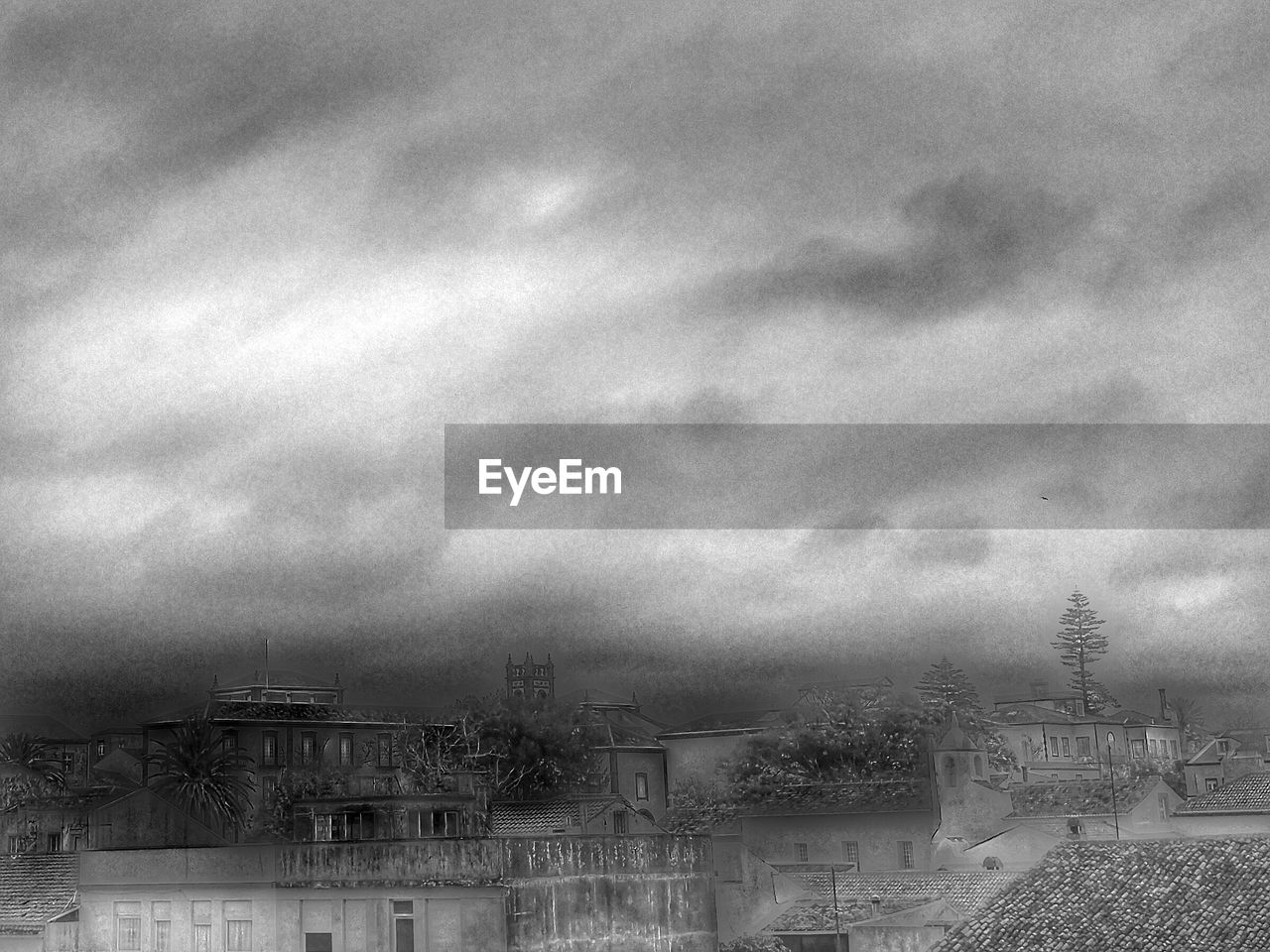CLOUDY SKY OVER CITY