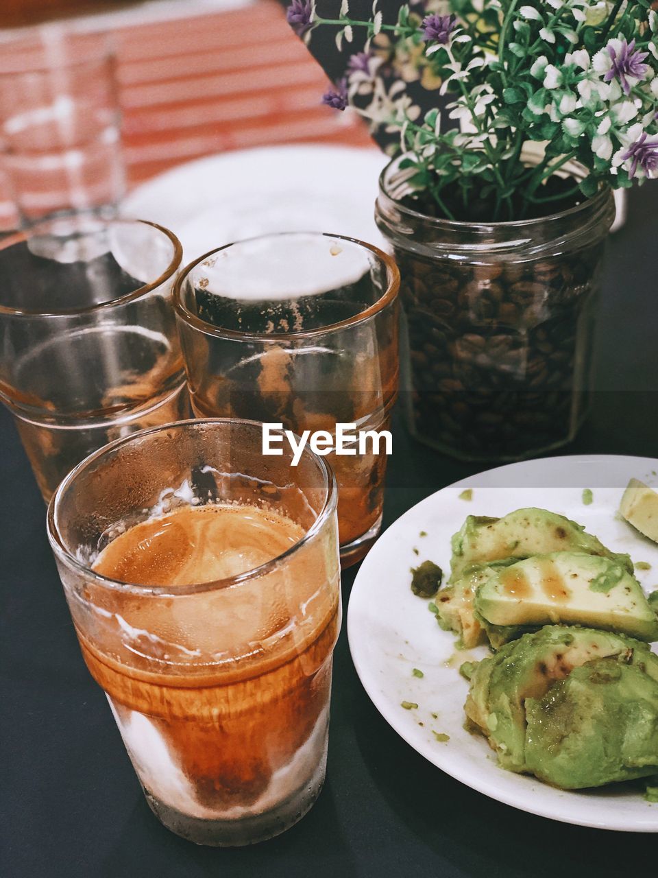 CLOSE-UP OF DRINK ON TABLE