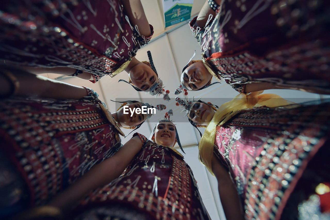 LOW ANGLE VIEW OF PEOPLE FOR SALE IN MARKET