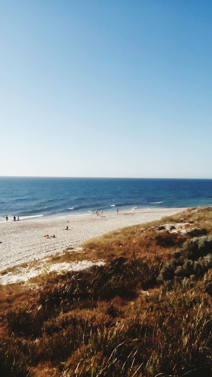 Scenic view of sea against clear blue sky