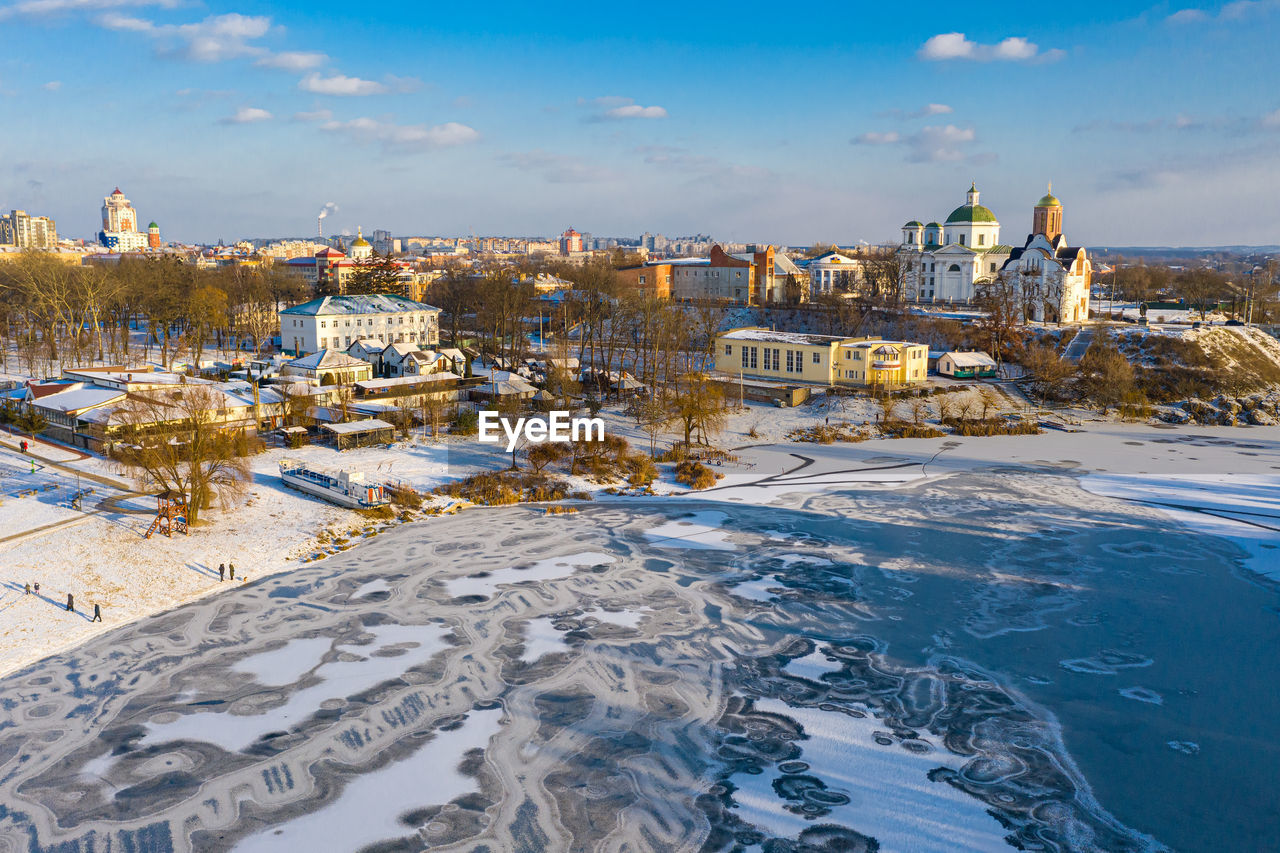 Nice top view of the winter city. bridge over river. orthodox churches and a catholic cathedral. 