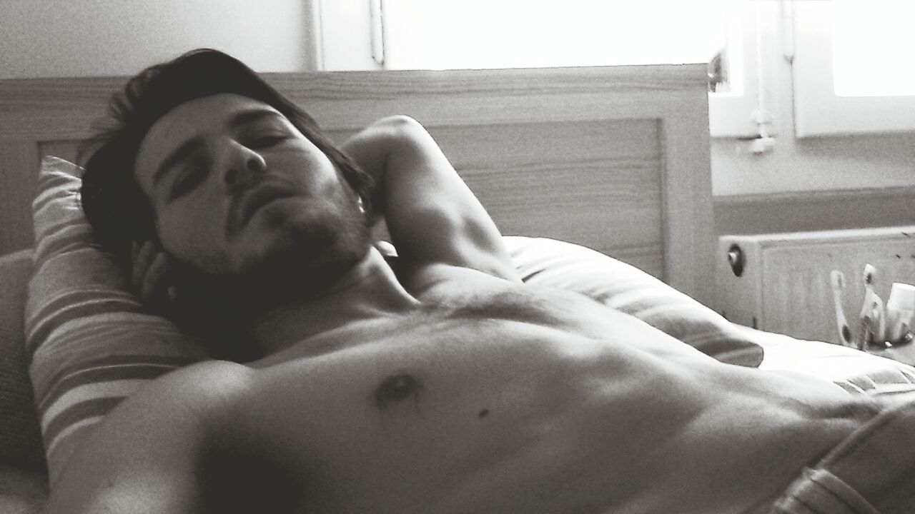 View of a shirtless young man sleeping