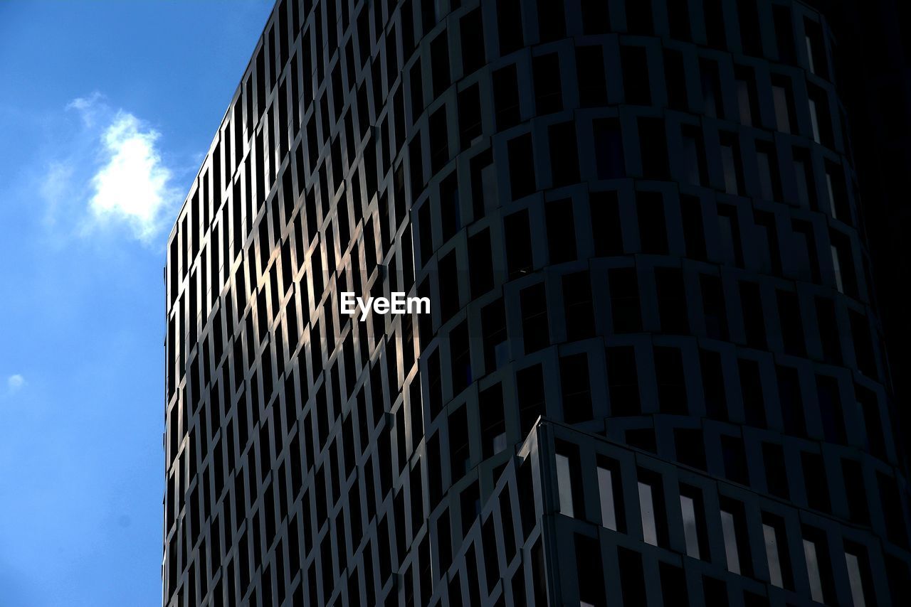 low angle view of skyscrapers against sky