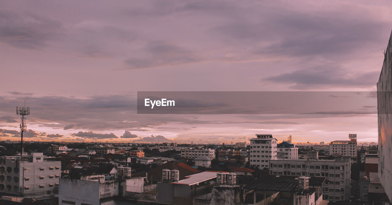 High angle view of buildings against sky at sunset