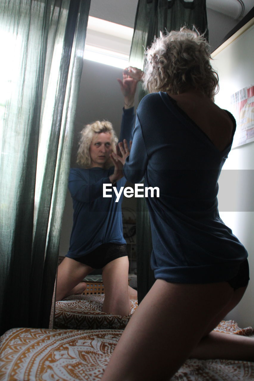 WOMEN SITTING AT HOME