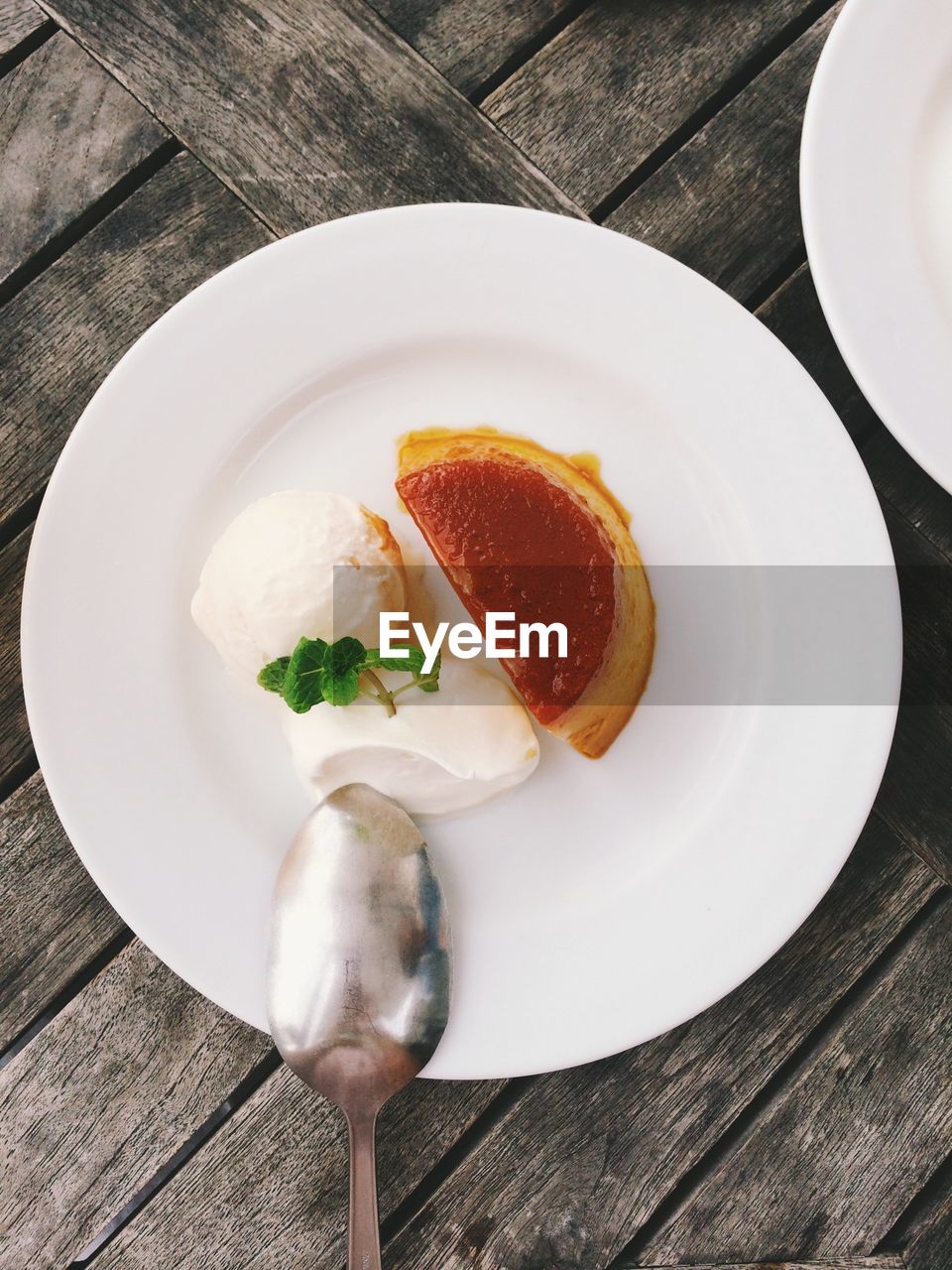 Ice cream and slice of cake on plate