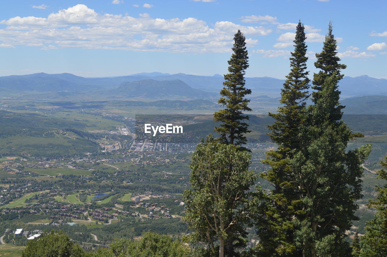 Scenic view of mountains against cloudy sky