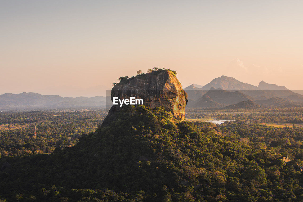 Sigiriya rock also known as lion rock at golden light of sunset. beautiful landscape in sri lanka.