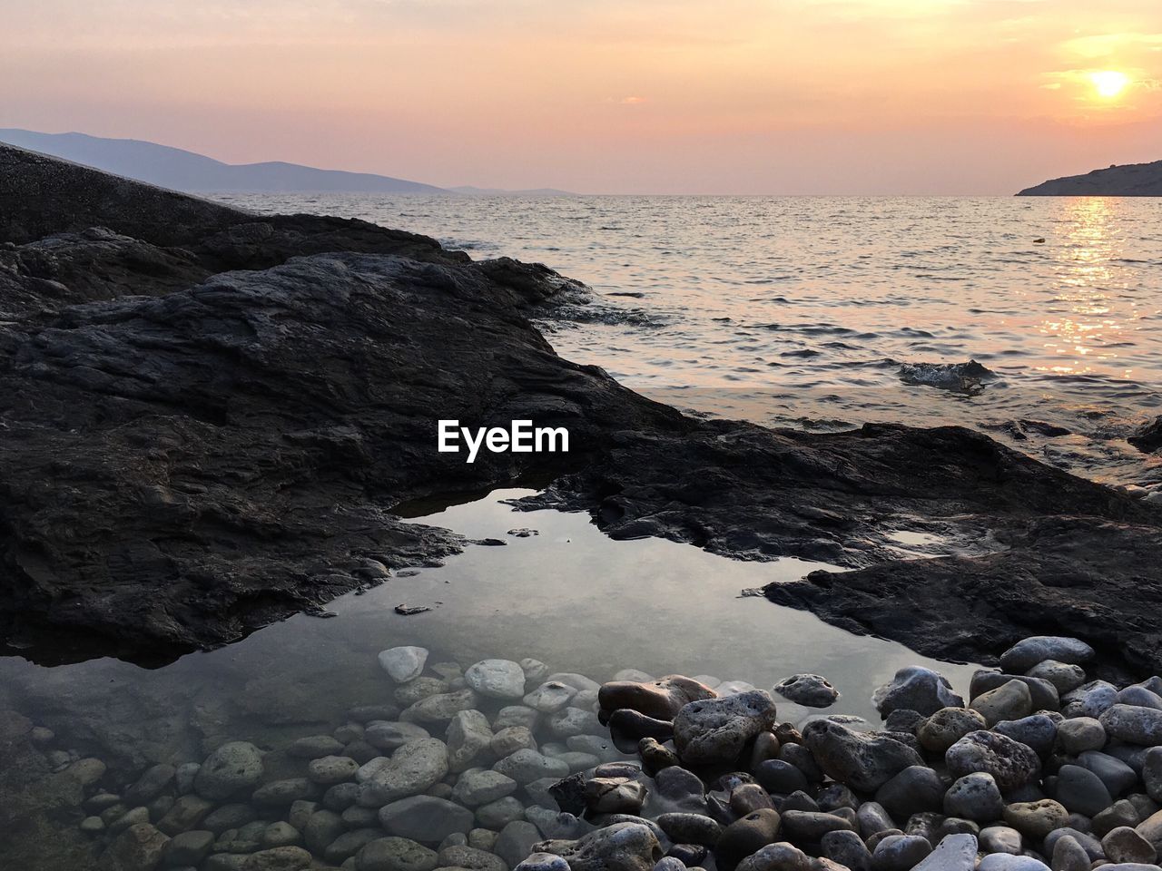 Scenic view of sea at sunset