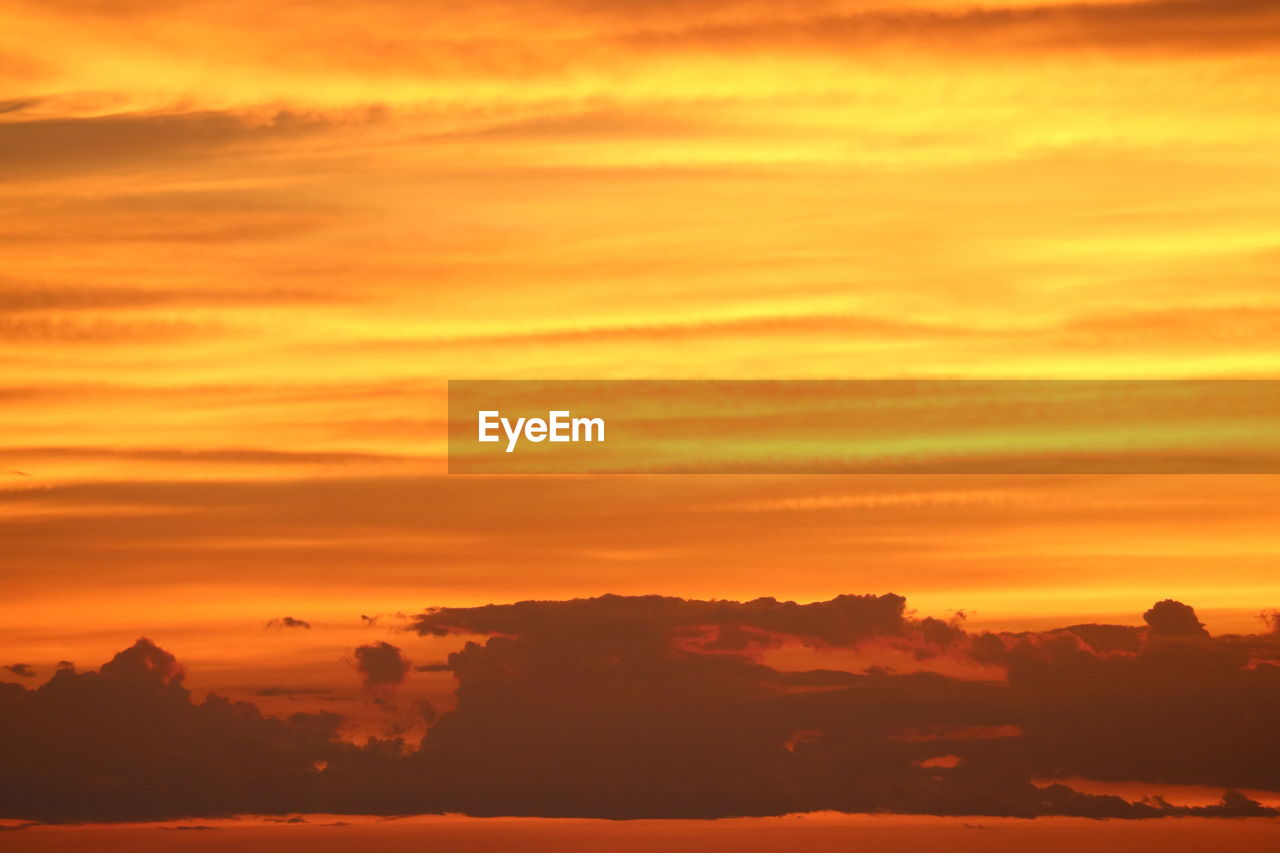 sky, sunset, cloud, beauty in nature, afterglow, environment, scenics - nature, landscape, nature, dramatic sky, red sky at morning, orange color, tranquility, horizon, tranquil scene, sun, idyllic, sunlight, cloudscape, no people, silhouette, travel, land, outdoors, travel destinations, gold, vibrant color, atmospheric mood, dawn, yellow, red, twilight, tourism, mountain, awe, urban skyline, water, multi colored, moody sky, romantic sky, holiday, light - natural phenomenon, summer, copy space, vacation, trip, non-urban scene, sea, evening, backgrounds