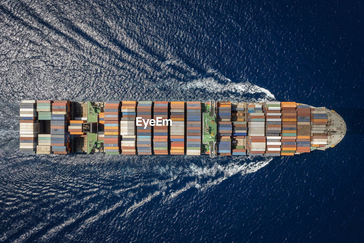 Aerial view of cargo ship in sea