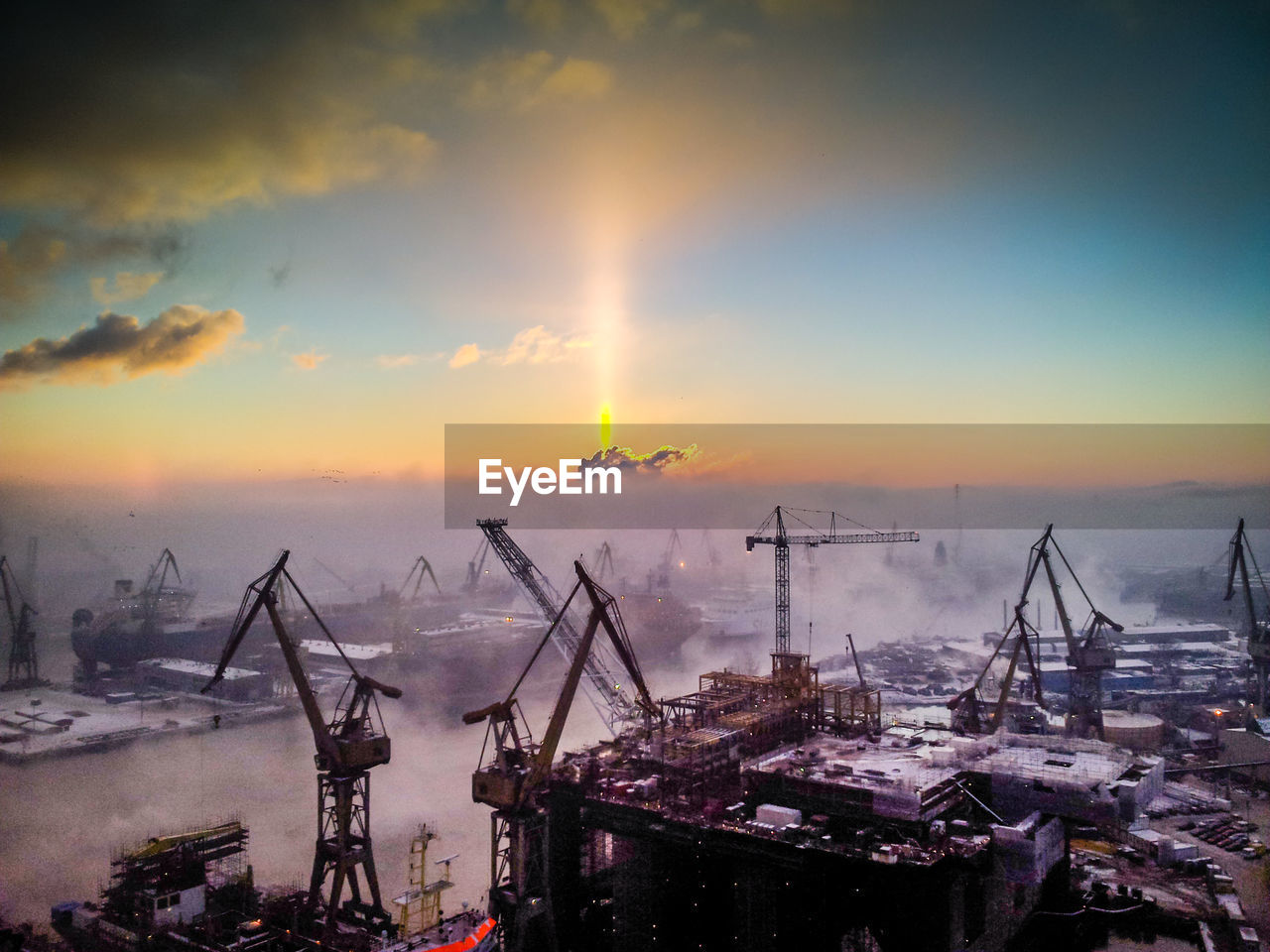 Aerial view of commercial dock during sunset