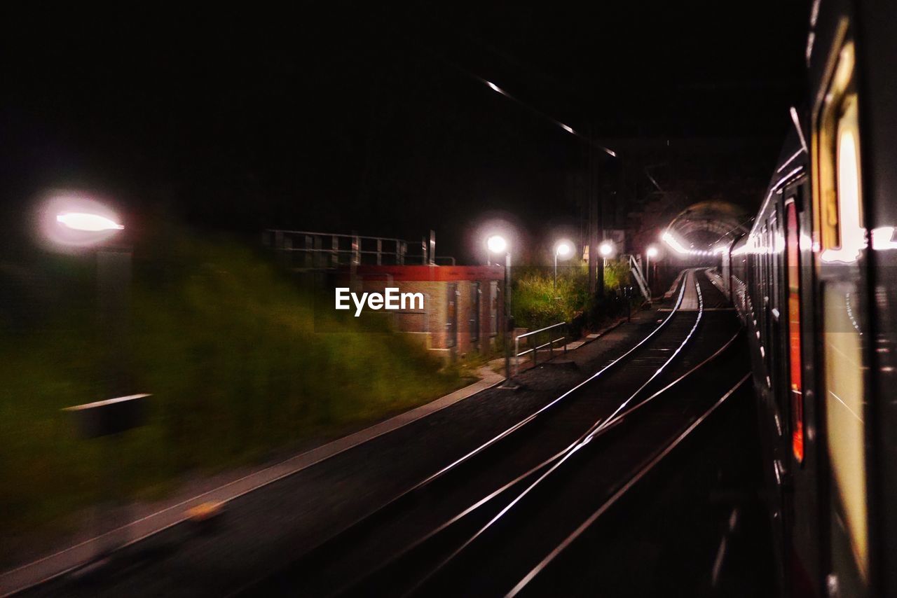 Illuminated street lights at railroad tracks