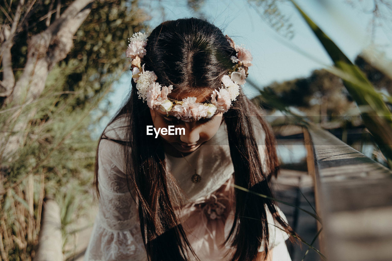 Close-up of girl wearing flower headband