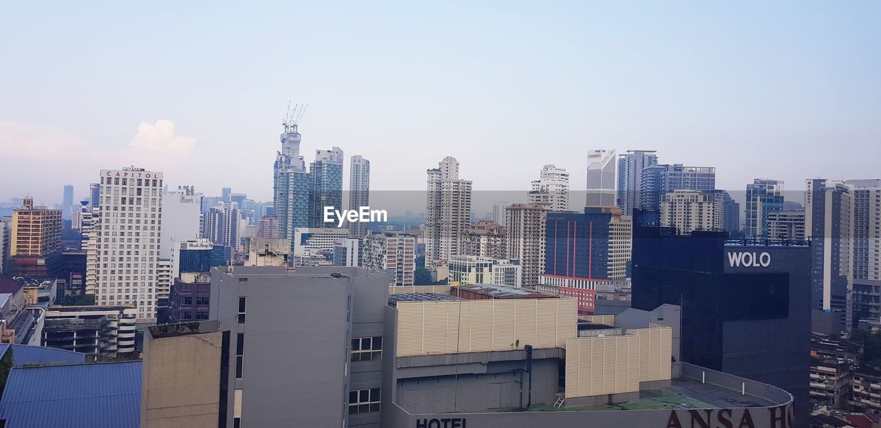 MODERN BUILDINGS AGAINST SKY IN CITY