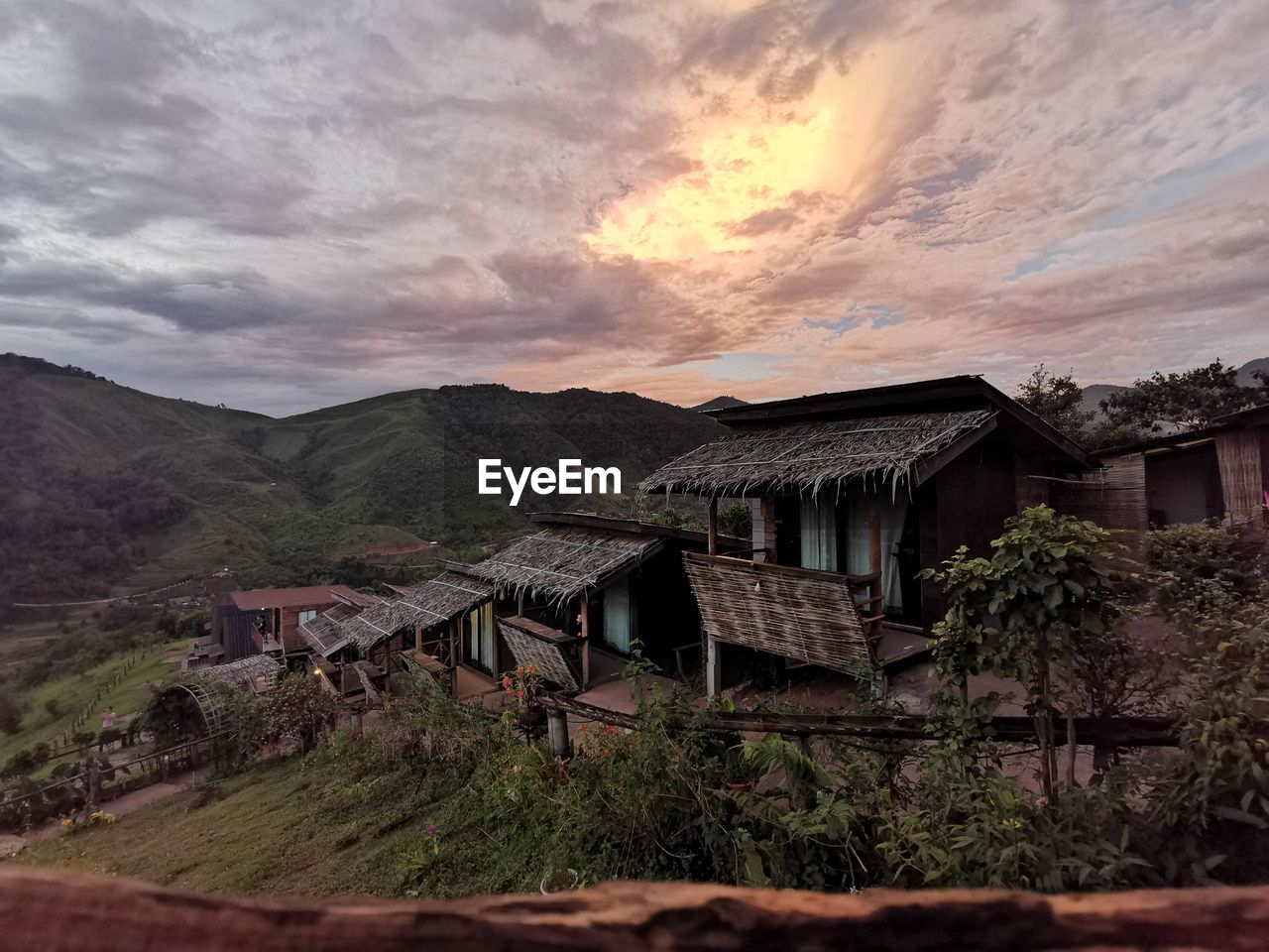 ABANDONED HOUSE BY MOUNTAIN AGAINST SKY