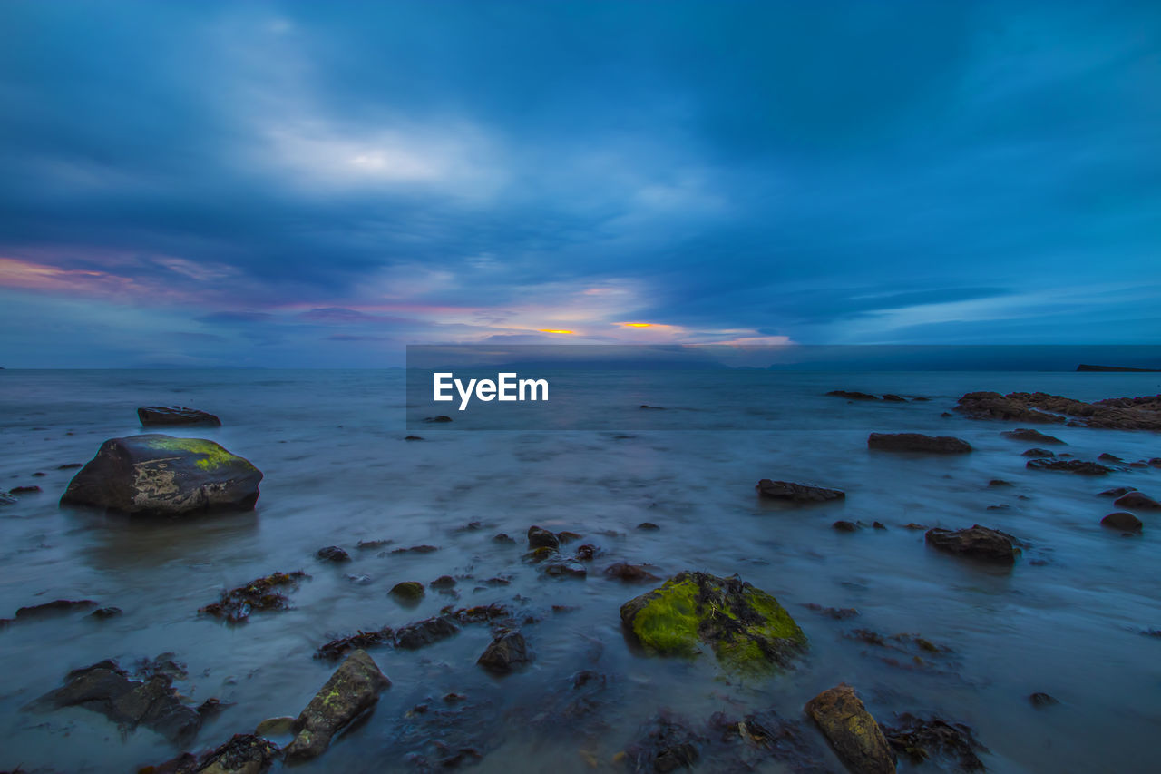 SCENIC VIEW OF SEA DURING SUNSET