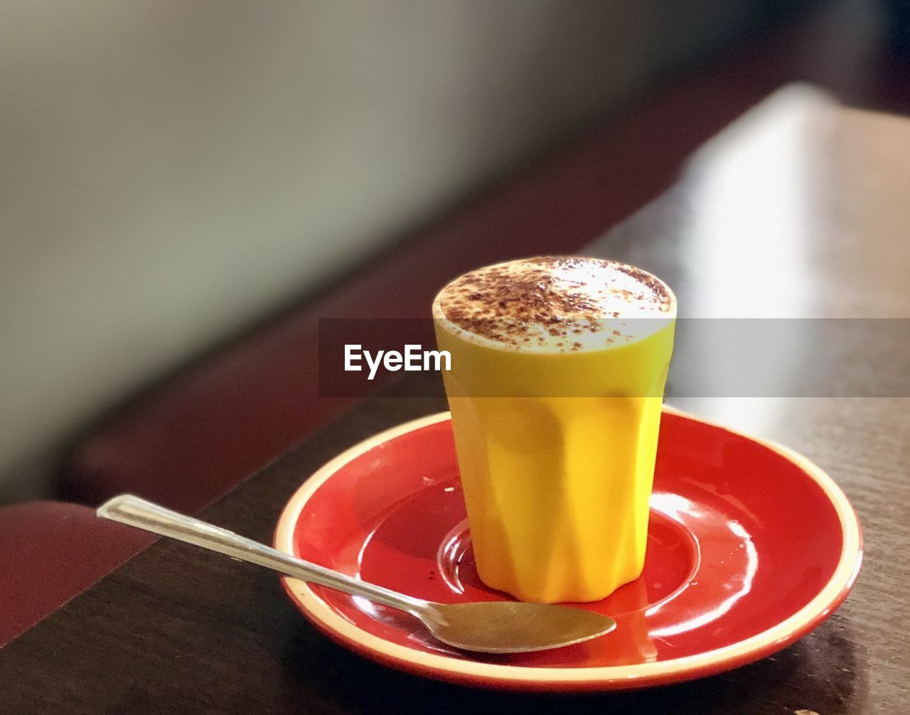 food and drink, drink, refreshment, table, food, saucer, crockery, indoors, coffee, hot drink, cup, freshness, no people, mug, produce, household equipment, dessert, spoon, still life, eating utensil, glass, drinking glass, kitchen utensil, focus on foreground, close-up, plate, alcoholic beverage, cafe