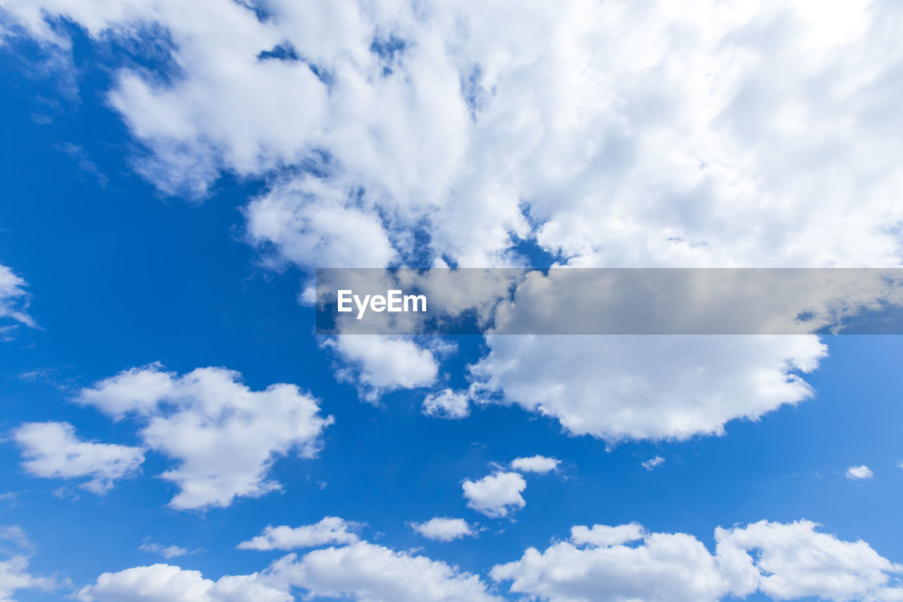 LOW ANGLE VIEW OF CLOUDS AGAINST BLUE SKY