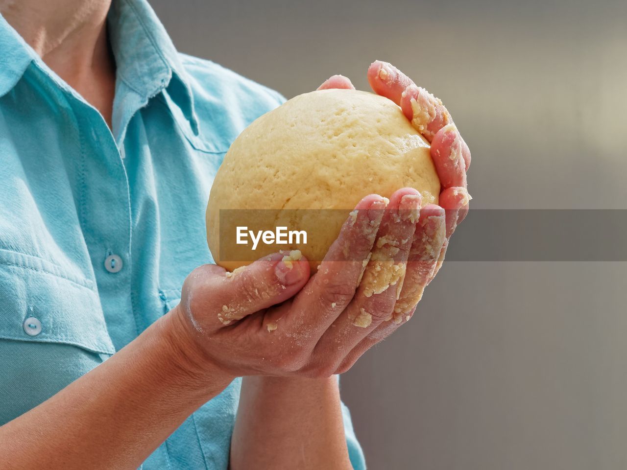 Close-up of man preparing food in kitchen counter