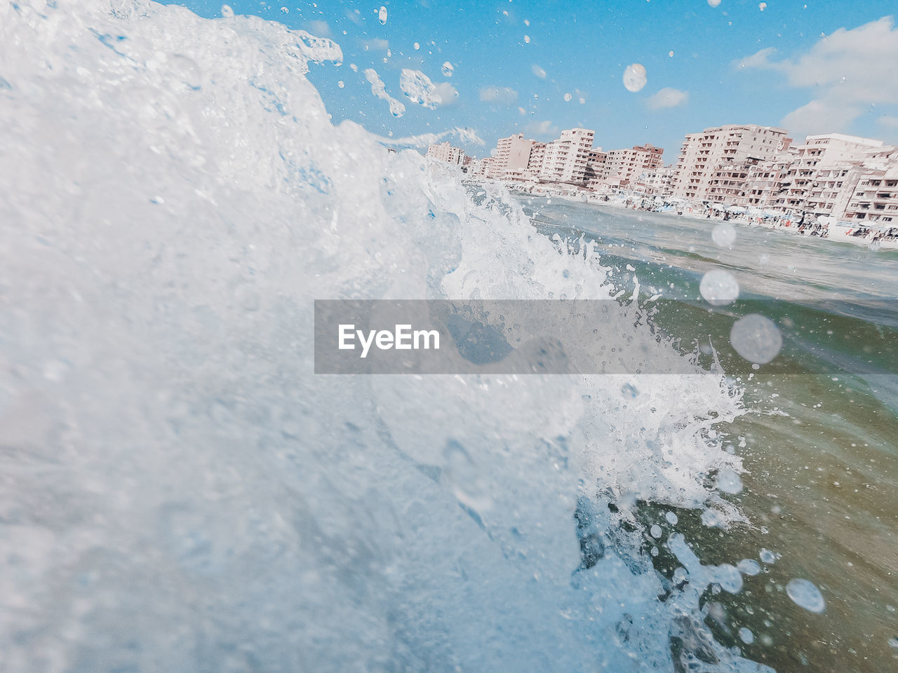 Sea waves splashing on snow