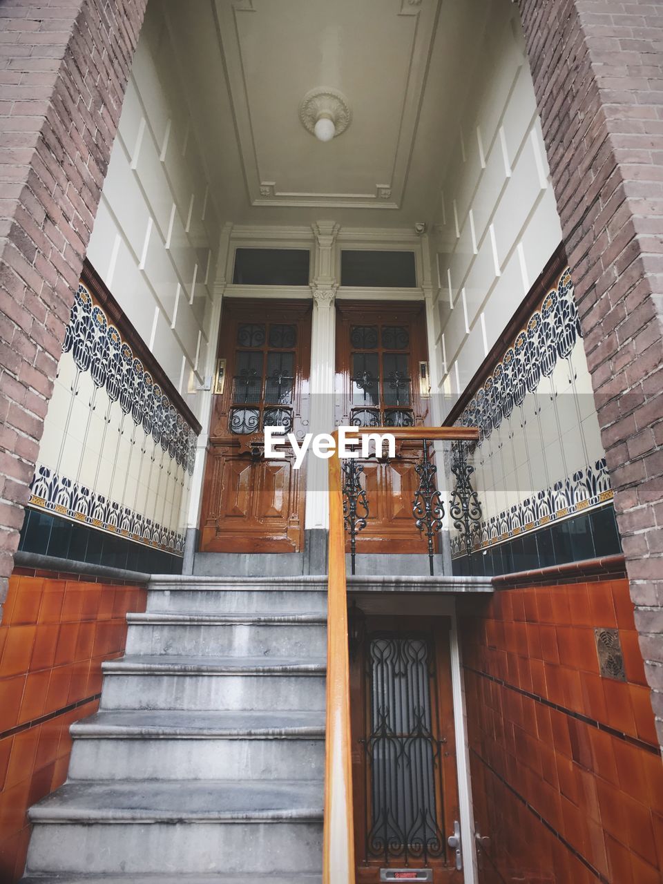 LOW ANGLE VIEW OF STAIRS ALONG BUILT STRUCTURE