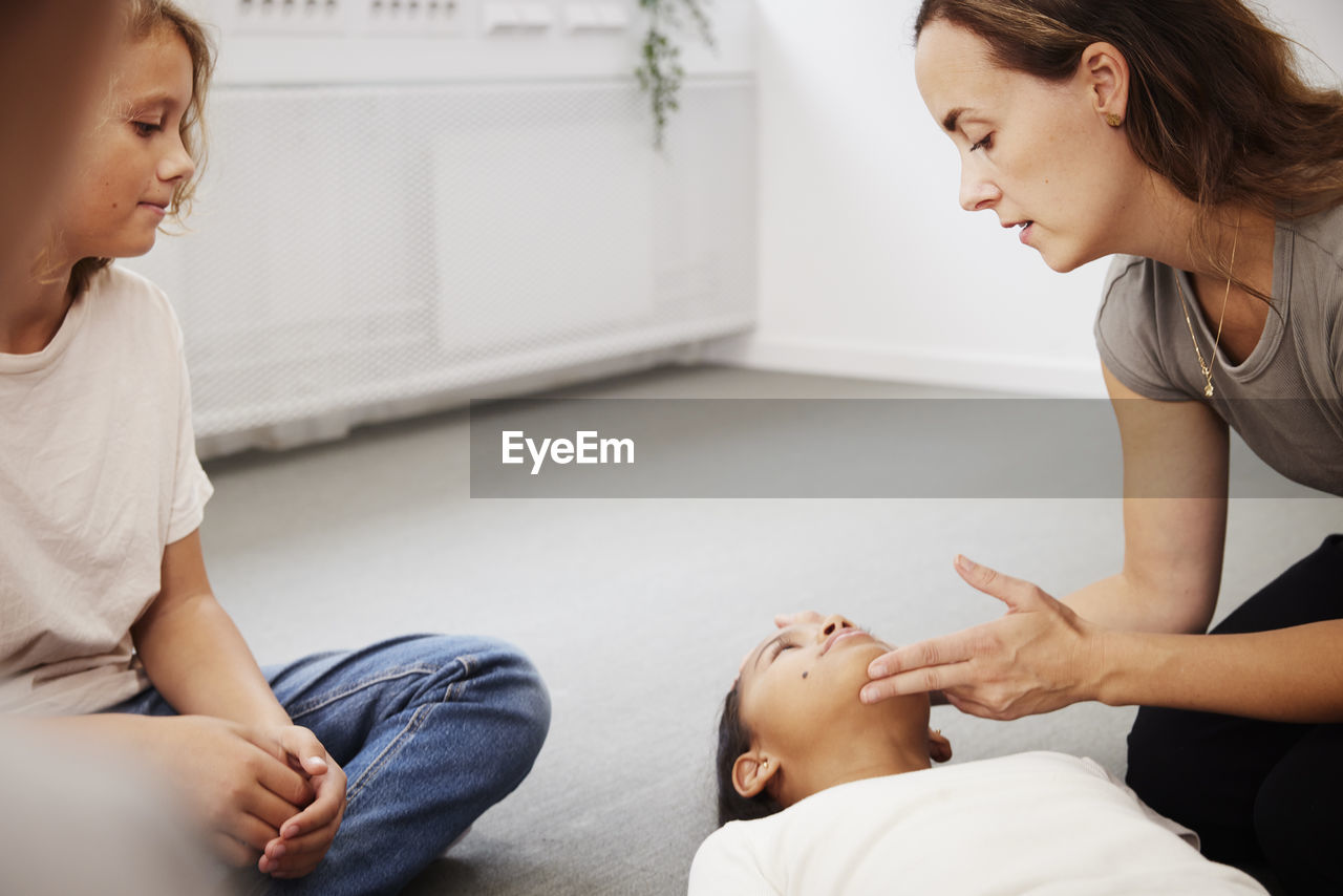 Teacher giving first aid training