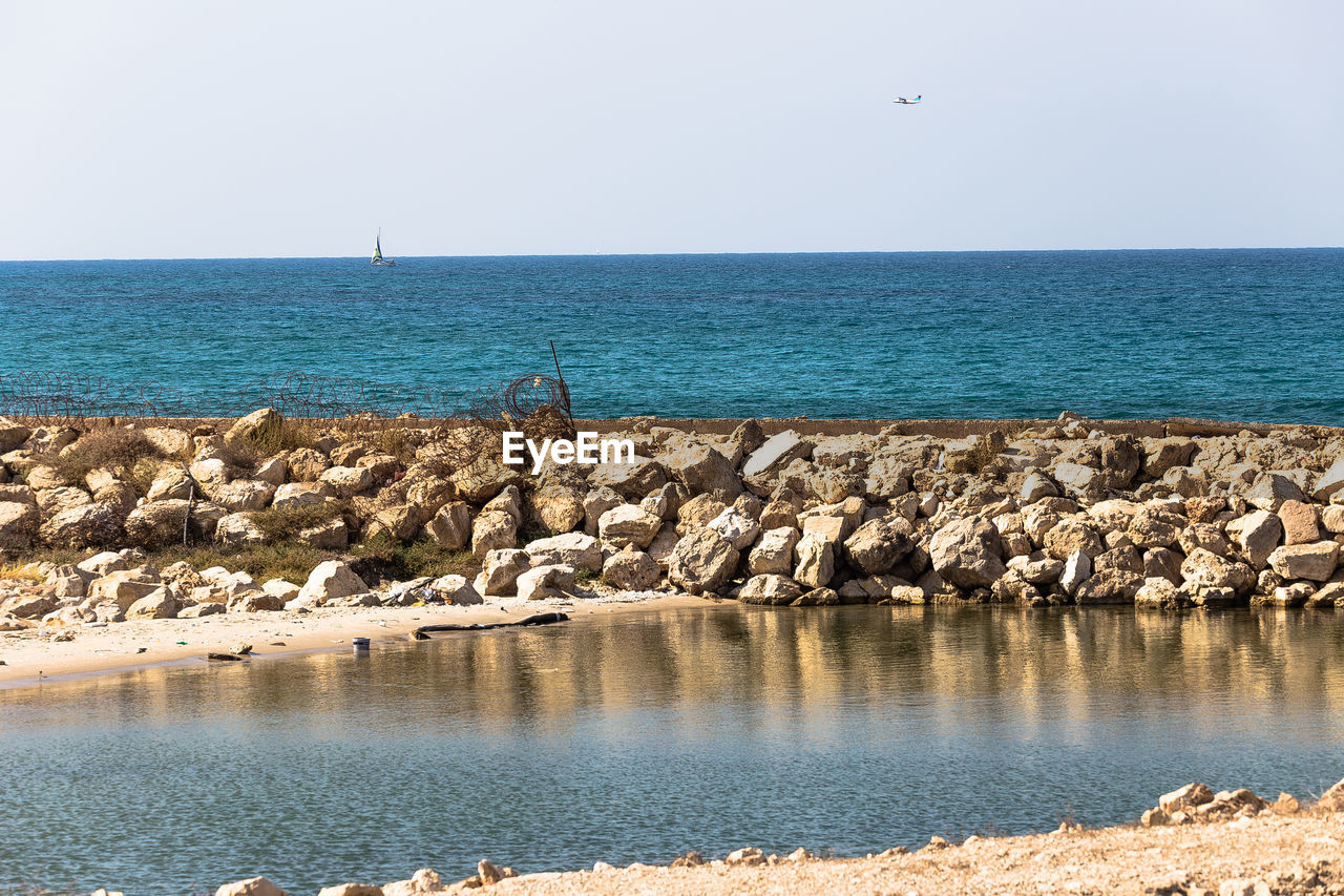 Scenic view of sea against clear sky