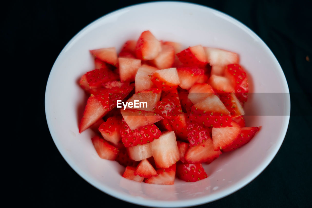 food and drink, healthy eating, food, fruit, strawberry, plant, berry, wellbeing, freshness, produce, red, bowl, no people, meal, black background, indoors, breakfast, directly above, close-up, high angle view, plate