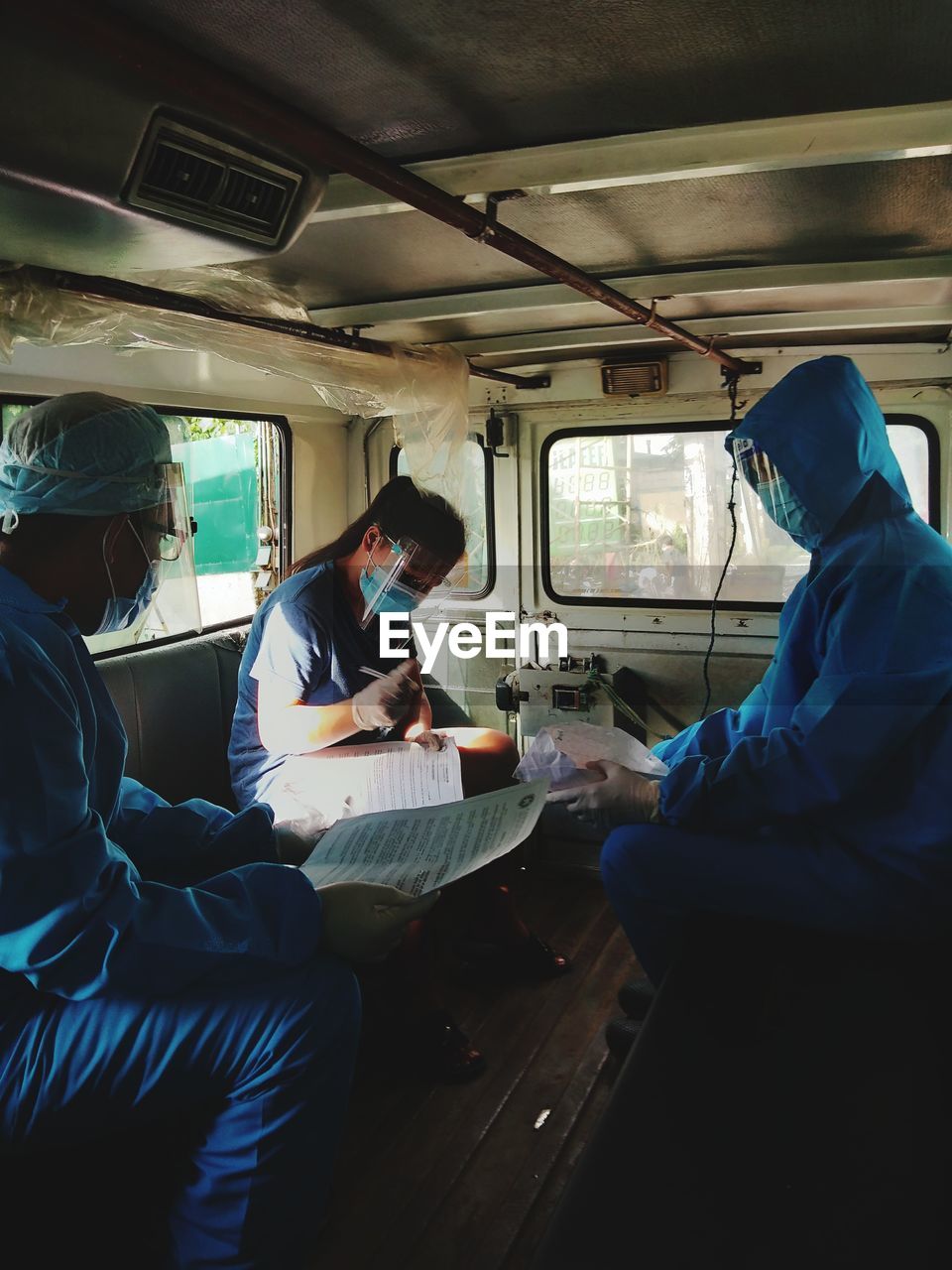 PEOPLE WORKING IN CAR
