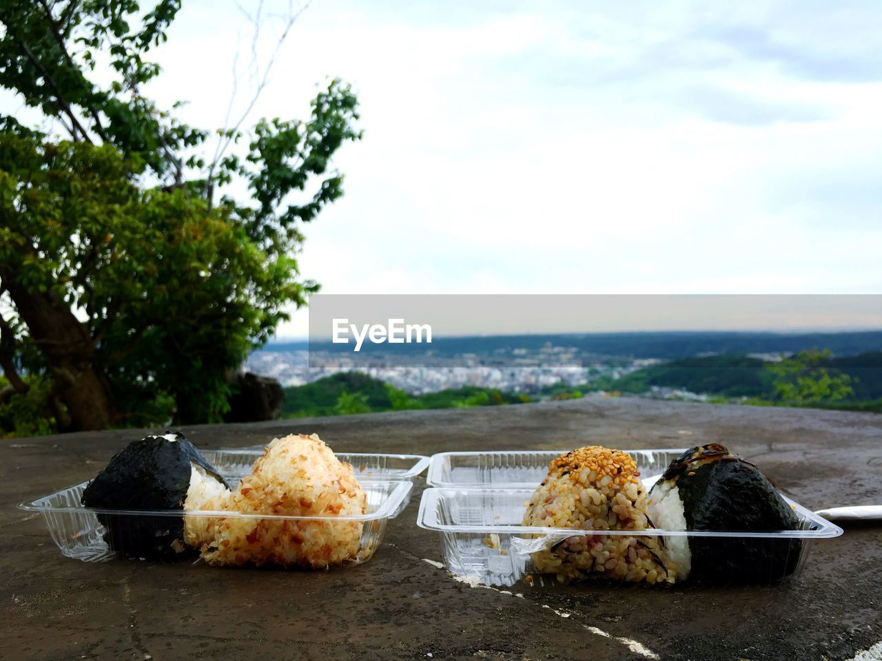 Food on table by sea against sky