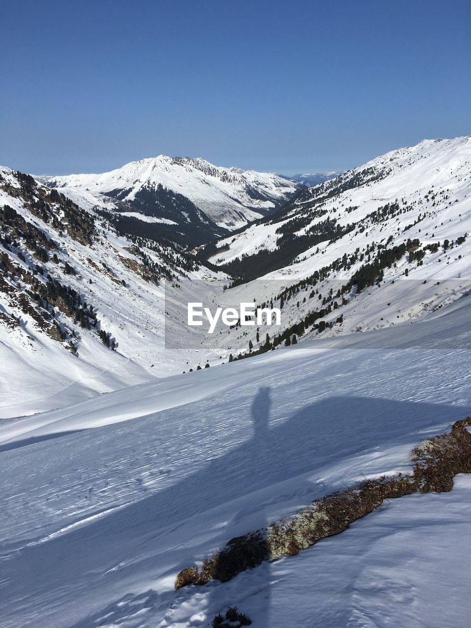 Scenic view of snow covered mountains against sky