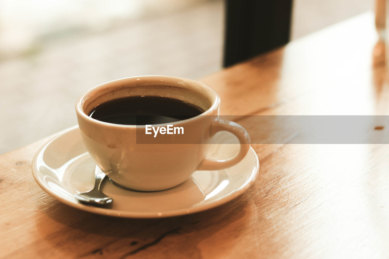 CUP OF COFFEE ON TABLE