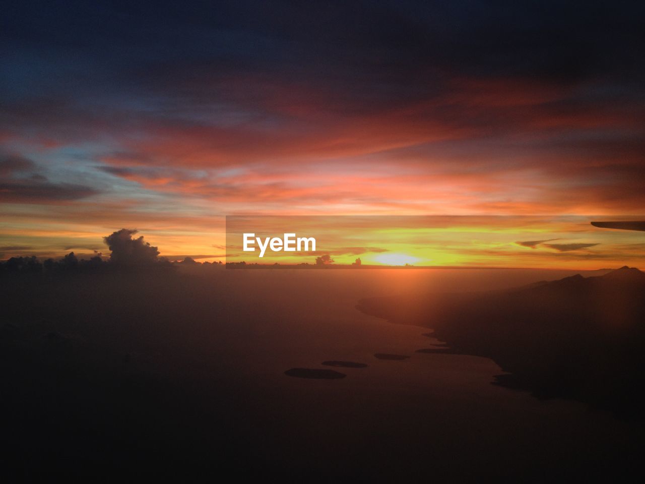 SILHOUETTE LANDSCAPE AGAINST SKY DURING SUNSET