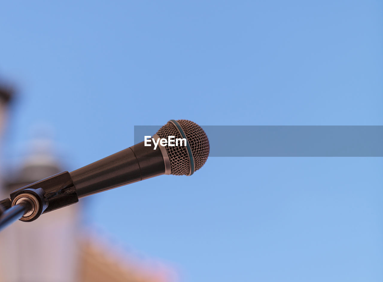 Close-up of microphone against clear sky